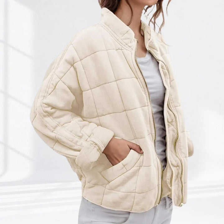 Chic women's lightweight quilted jacket. This padded coat with a stand collar offers autumn comfort.