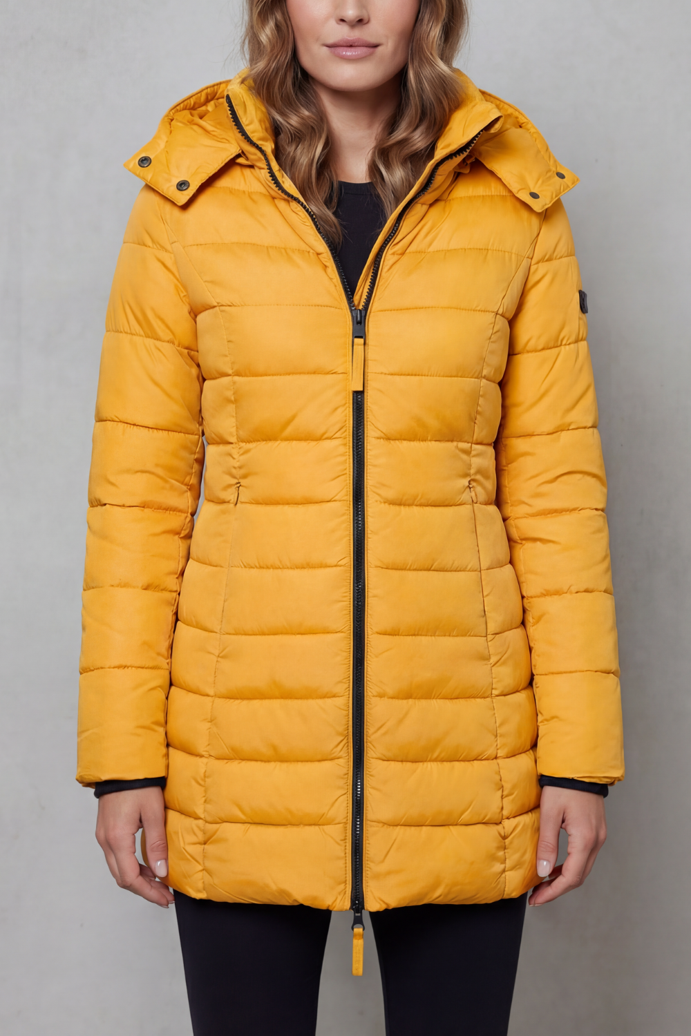 Women's warm quilted puffer jacket, a lightweight and fashionable outerwear choice for cold days.