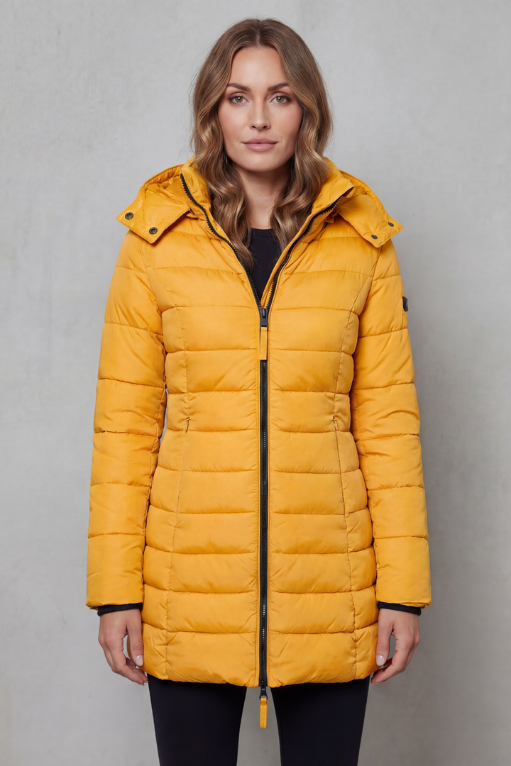 Modern women's quilted puffer coat, lightweight design, provides stylish warmth for any occasion.