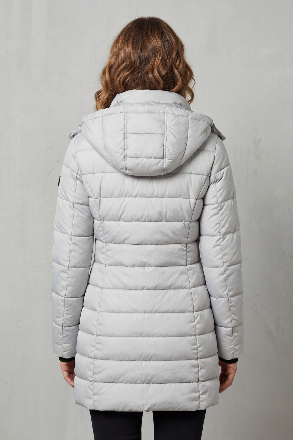 Lightweight women's puffer coat with stylish quilting, essential for winter fashion layering.