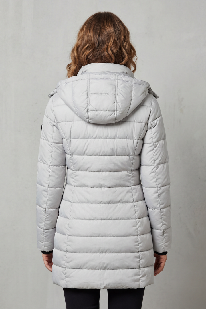 Lightweight women's puffer coat with stylish quilting, essential for winter fashion layering.