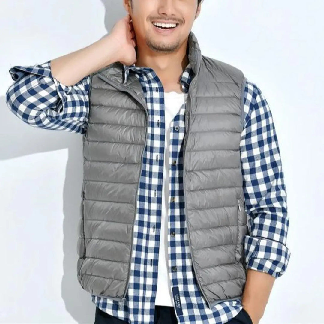 Versatile women's sleeveless quilted puffer vest. Lightweight zip-up gilet, ideal for cool weather layering.