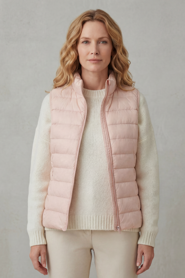 Stylish women's layering vest, quilted for a refined casual appearance.