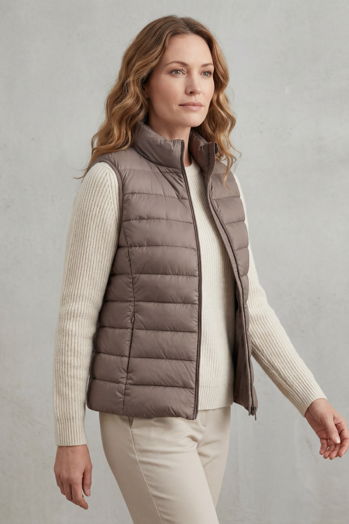 Casual women's sleeveless jacket, quilted for seasonal warmth.