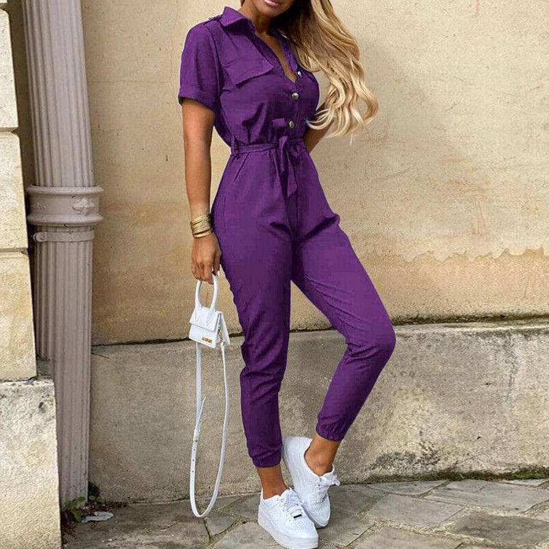 Lightweight women's jumpsuit with short sleeves & full button front, offering a structured, modern fit.