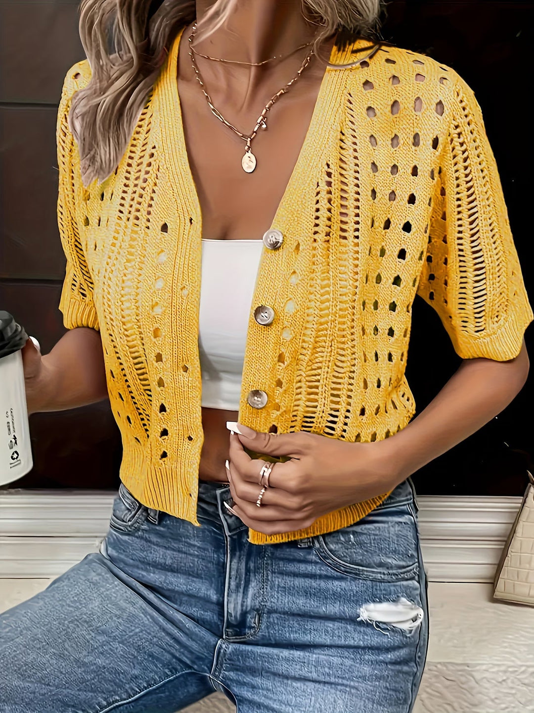 Stylish short sleeve women's summer cardigan. Open-front, lightweight layer for elegant warm weather fashion.