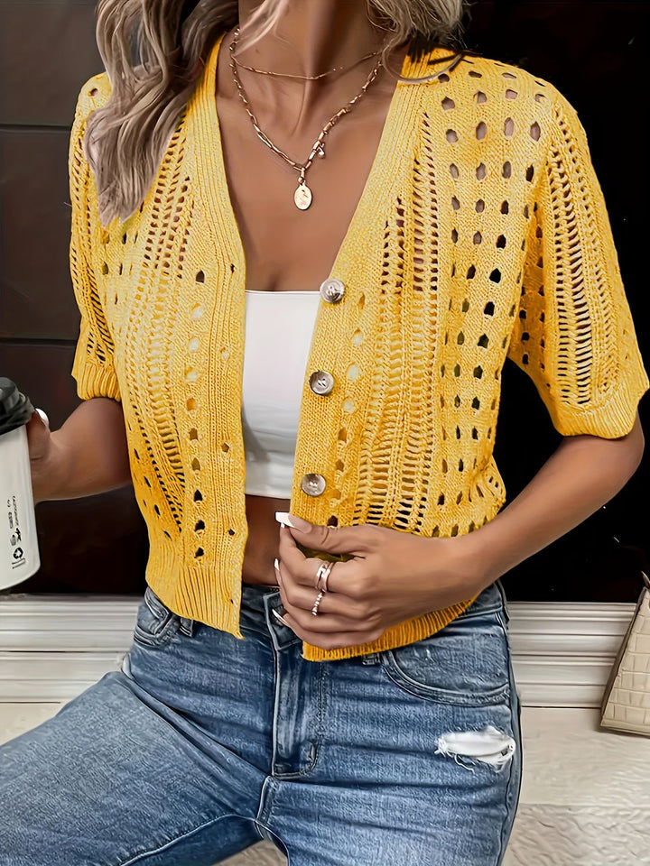 Stylish short sleeve women's summer cardigan. Open-front, lightweight layer for elegant warm weather fashion.