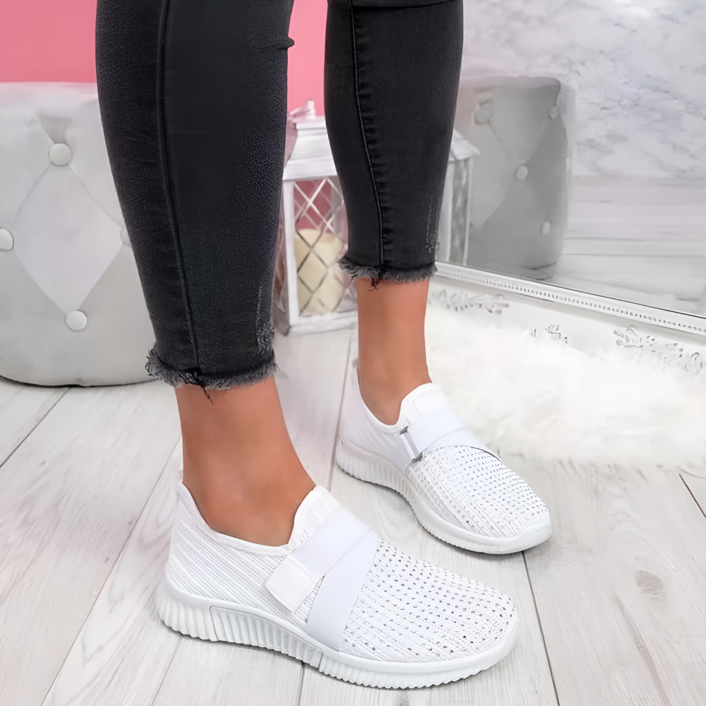 Everyday women's comfort trainers, lightweight slip-on design with elastic strap for walking & athletic use.