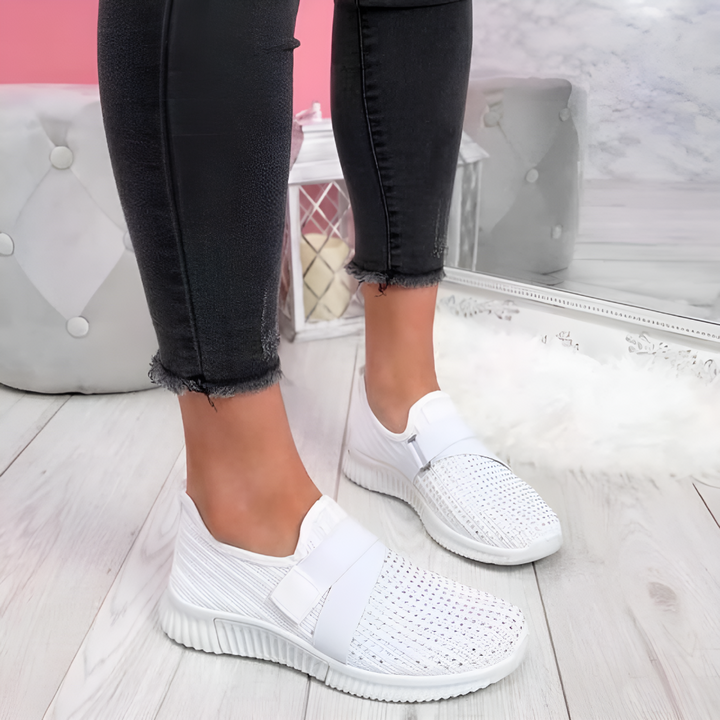 Everyday women's comfort trainers, lightweight slip-on design with elastic strap for walking & athletic use.