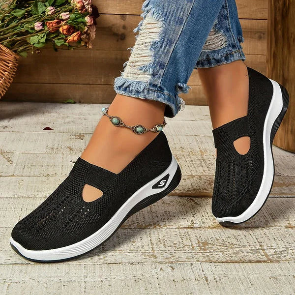 Lightweight women's comfort shoes: slip-on sneakers with a modern cut-out design, ideal for active days.