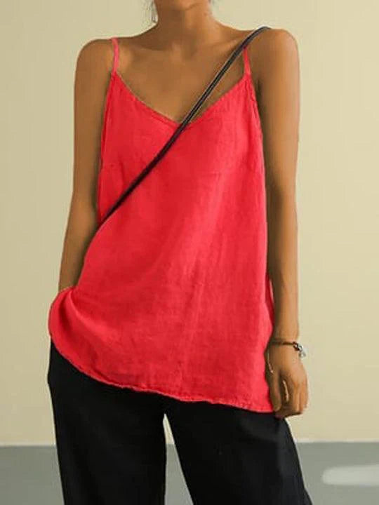 Versatile women's fashion: a relaxed fit spaghetti strap top for summer layering.