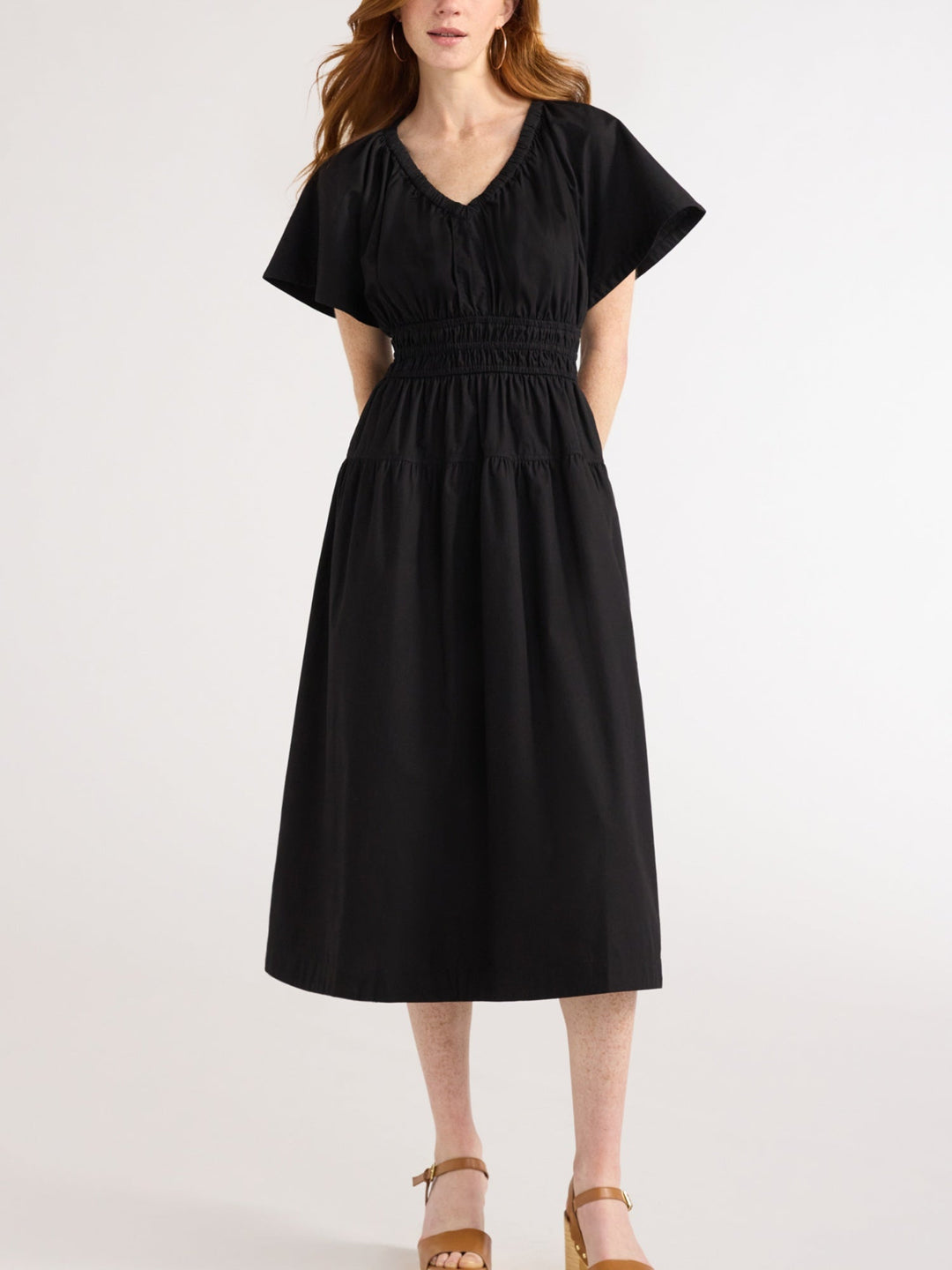 Comfortable V-neck tiered midi dress for women, featuring elastic waist & practical pockets. Effortless everyday style.