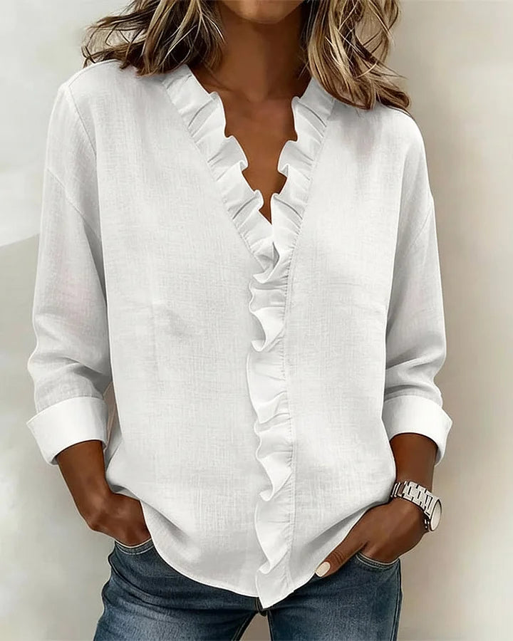 Stylish long sleeve V-neck top for women, featuring feminine ruffled details.