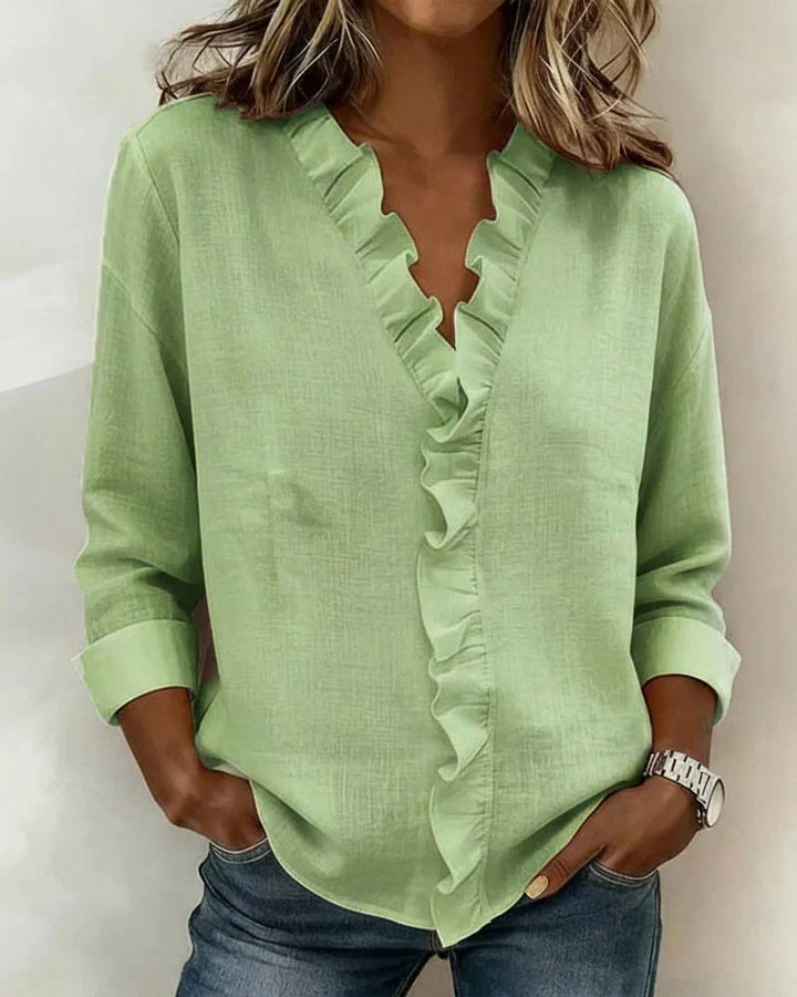 Casual yet elegant women's ruffled blouse with a relaxed fit V-neck, lightweight.