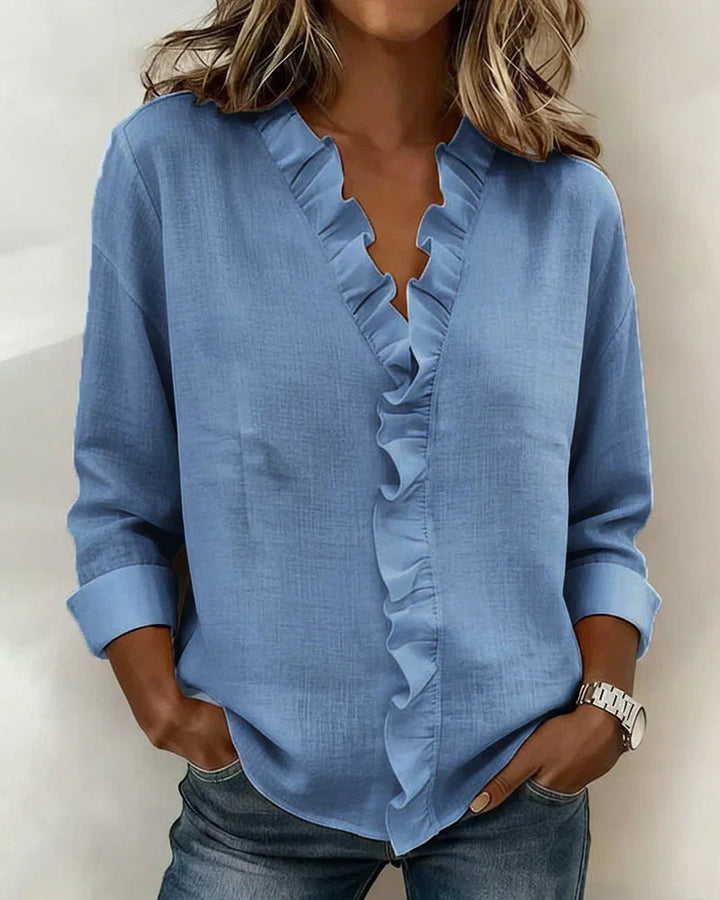Versatile V-neck top, lightweight women's blouse with delicate ruffles for everyday wear.