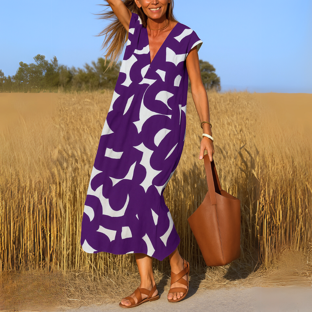 Flowy women's lightweight V-neck summer dress; comfortable, casual & elegant, ideal for versatile warm-weather fashion.