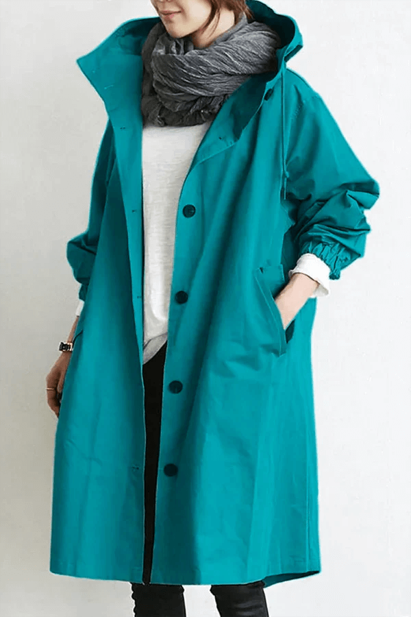 Women's lightweight waterproof rain cape for ultimate weather protection & stylish outdoor fashion.