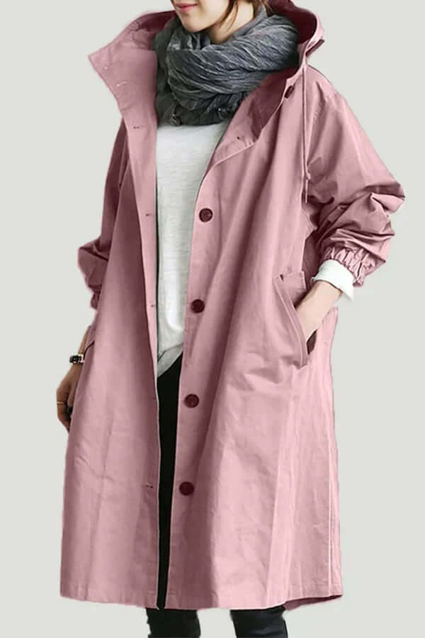Stylish women's rain cape, lightweight & waterproof. Versatile outerwear for travel & daily wear.
