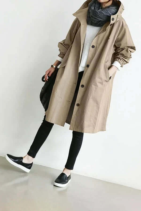 Fashionable women's rain cape. Stylish waterproof jacket for elegant outdoor protection.