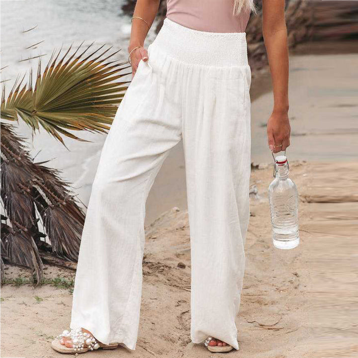 Close-up of the smocked waistband on comfortable women's linen trousers.