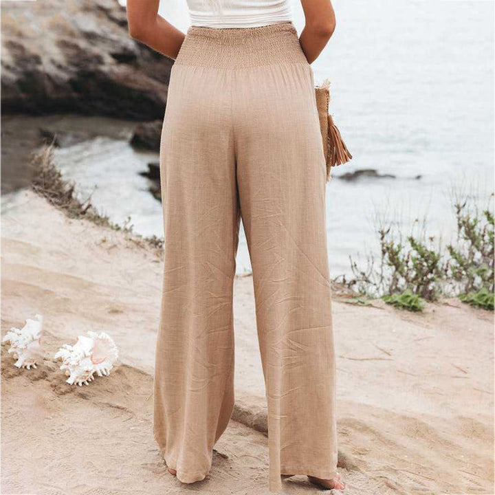 Flowy silhouette of women's summer pants made from breathable linen fabric.