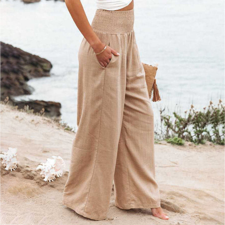 Women's casual wear: stylish wide leg linen trousers in a light blue hue.