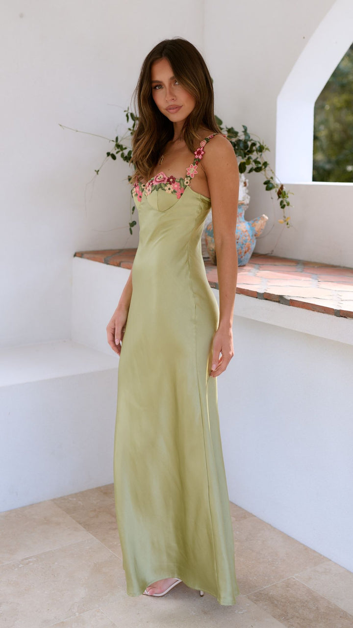 Stylish women's floral slip maxi dress in a flattering bodycon fit, ideal for spring fashion evenings.