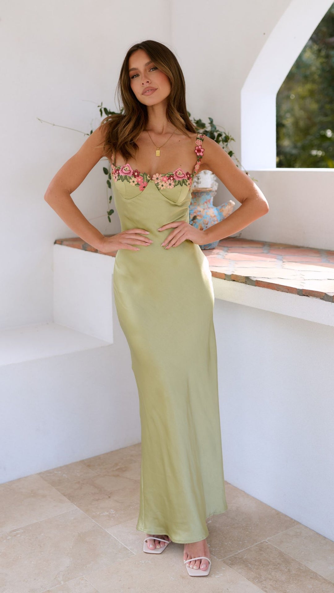 Elegant women's bodycon floral maxi slip dress with thin spaghetti straps, suitable for parties & events.