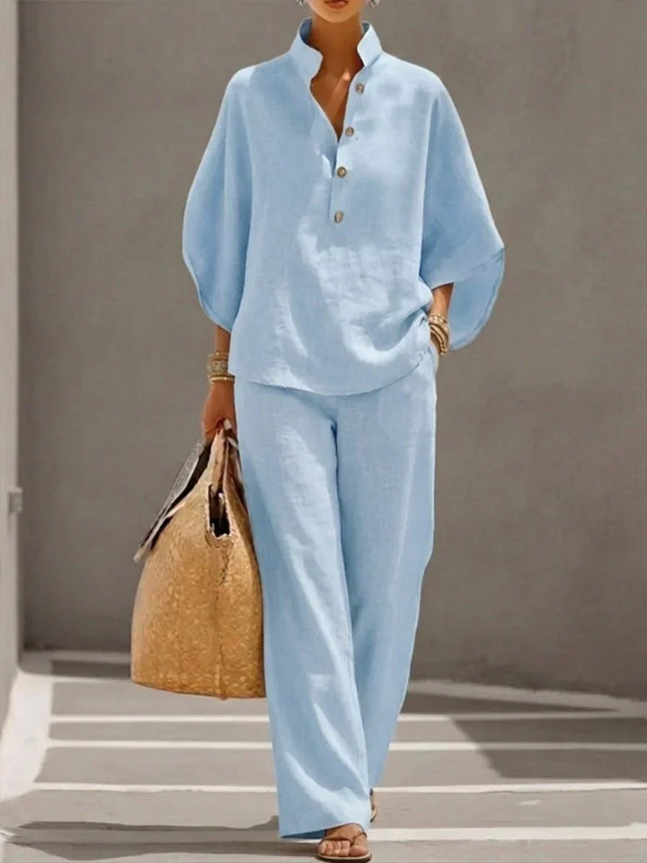 Casual chic women's two-piece set featuring a comfy linen-blend batwing top and flowy wide-leg trousers.