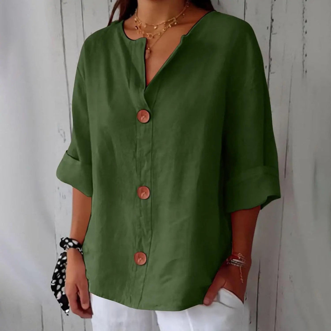 Sophisticated women's three quarter sleeve linen top, featuring a button front; perfect for elegant casual wear.