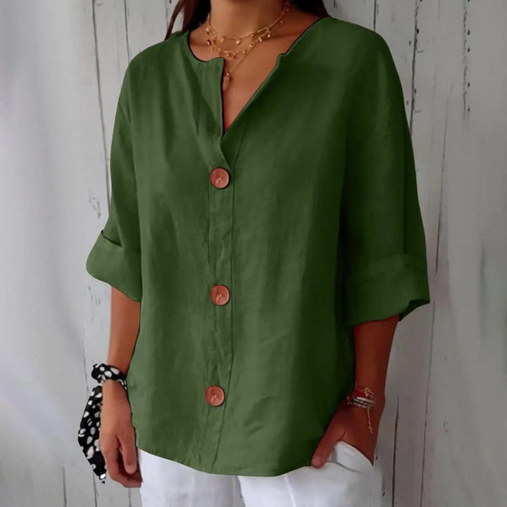 Sophisticated women's three quarter sleeve linen top, featuring a button front; perfect for elegant casual wear.