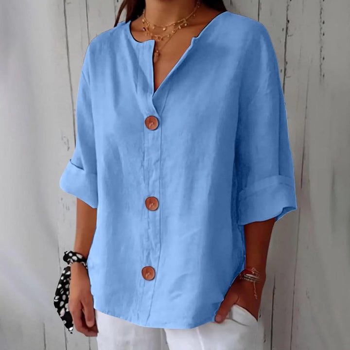 Lightweight women's linen button front blouse with three quarter sleeves, ideal for comfortable spring and summer days.