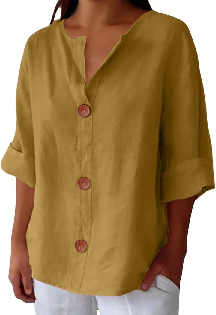 Versatile women's spring blouse with three quarter sleeves and button front closure, ideal for casual outfits.