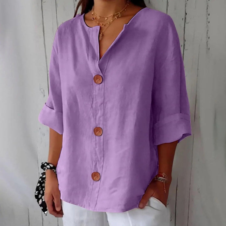 Casual three quarter sleeve linen top for women, featuring a classic button front; great for relaxed everyday style.