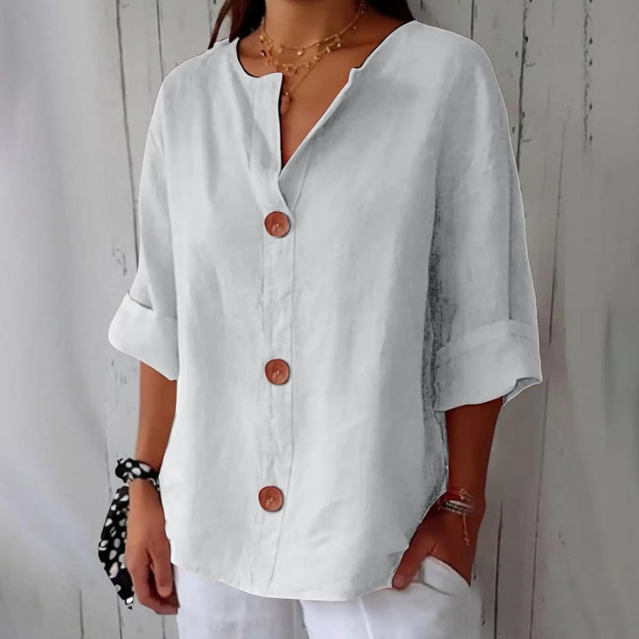 Women's summer button front blouse, made from breathable linen with stylish three quarter sleeves for comfort.