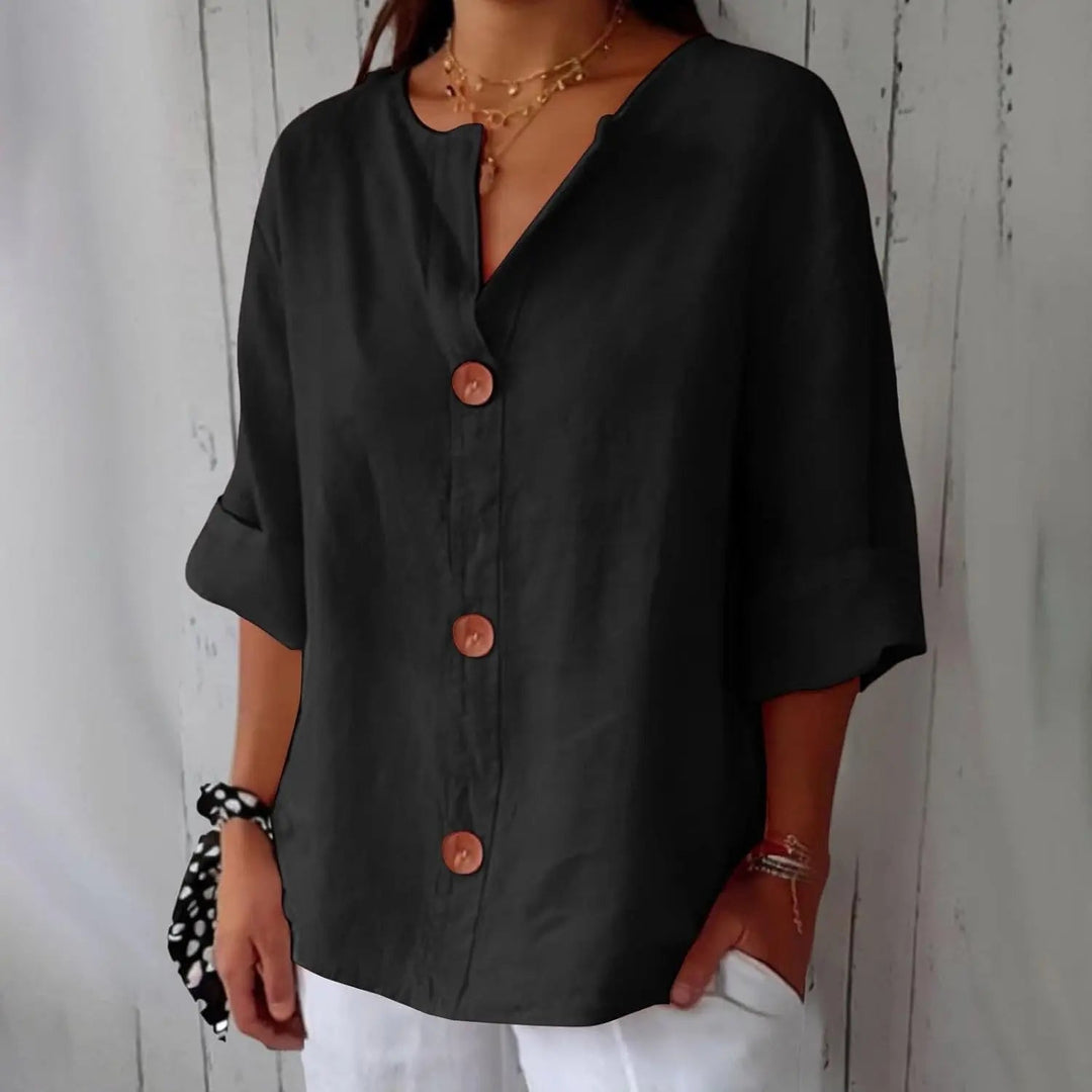 Chic women's linen button front blouse; three quarter sleeves, relaxed fit for versatile summer and spring fashion.