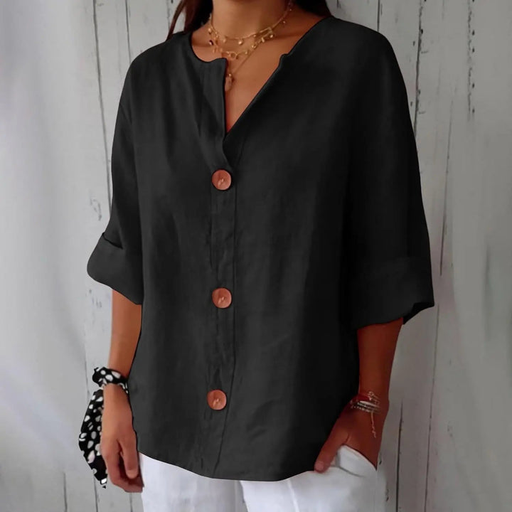 Chic women's linen button front blouse; three quarter sleeves, relaxed fit for versatile summer and spring fashion.
