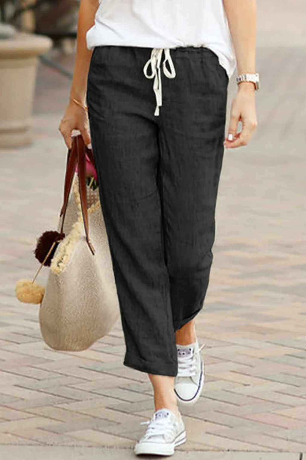 Women's elegant linen cropped trousers with a comfortable drawstring waist, ideal for versatile summer fashion.