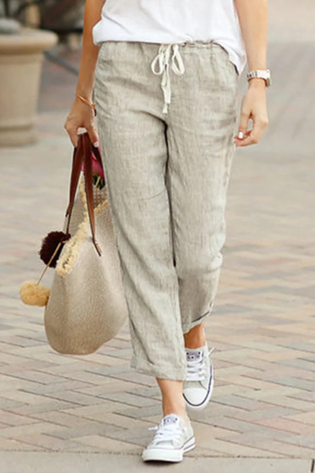 Comfortable women's linen blend cropped trousers with adjustable drawstring waist for relaxed summer style.