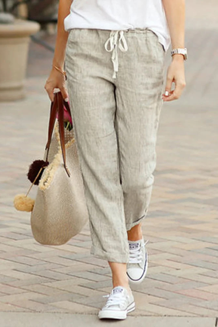 Comfortable women's linen blend cropped trousers with adjustable drawstring waist for relaxed summer style.