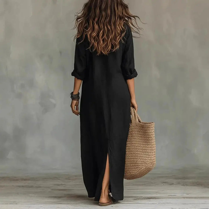 Woman wearing a versatile long sleeve button down maxi shirt dress, styled casually for a comfortable day look.