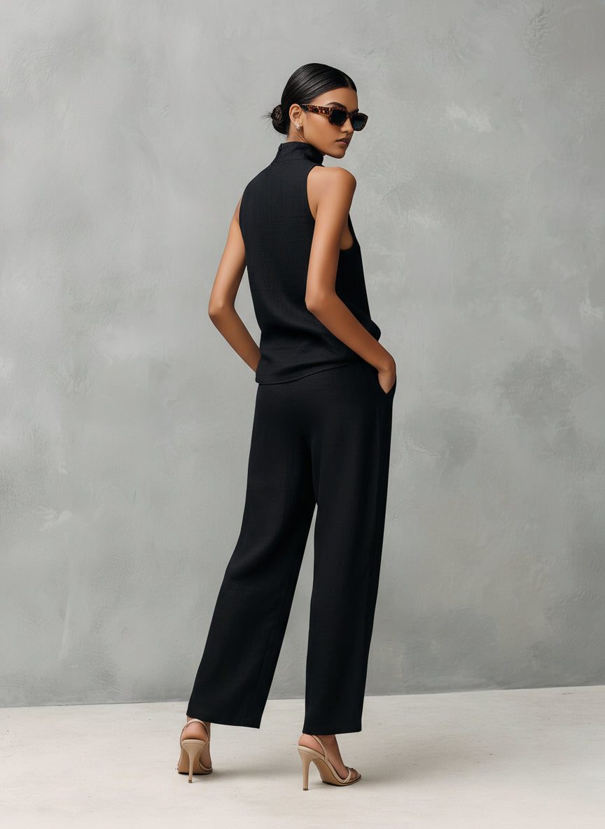 Stylish women's sleeveless roll neck top & matching straight leg linen trousers set. Smart casual outfit.