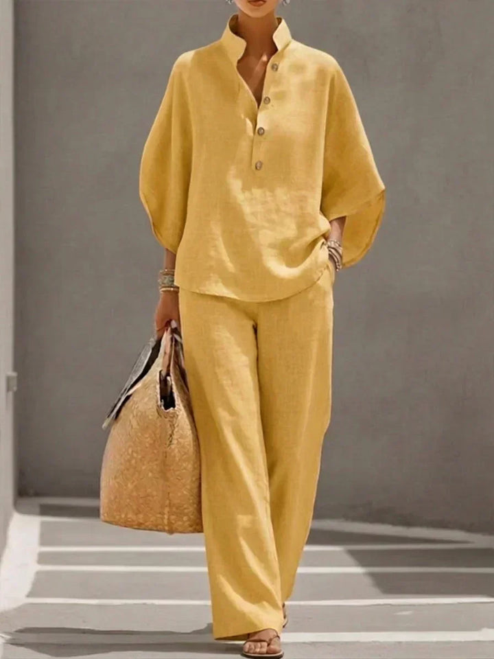Chic women's two-piece linen outfit with stylish batwing sleeves and comfortable wide-leg pants.