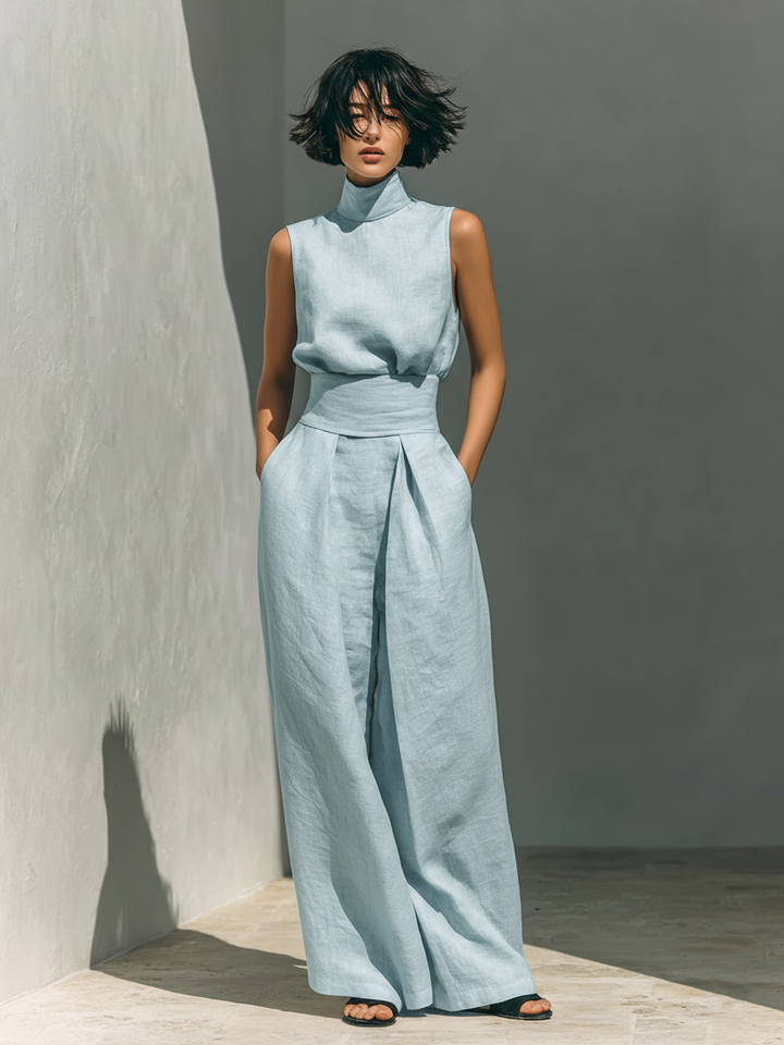 Lightweight linen women's two-piece set with a sleeveless roll neck top and wide-leg trousers.