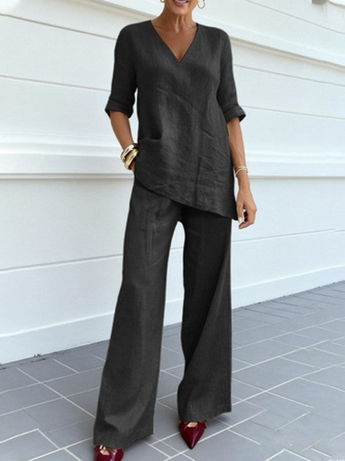 Breathable women's linen set, relaxed fit v-neck top & wide leg pants, ideal for comfortable casual summer.