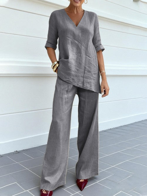 Women's linen v-neck top and matching wide leg pants two-piece set, versatile for casual & smart summer.