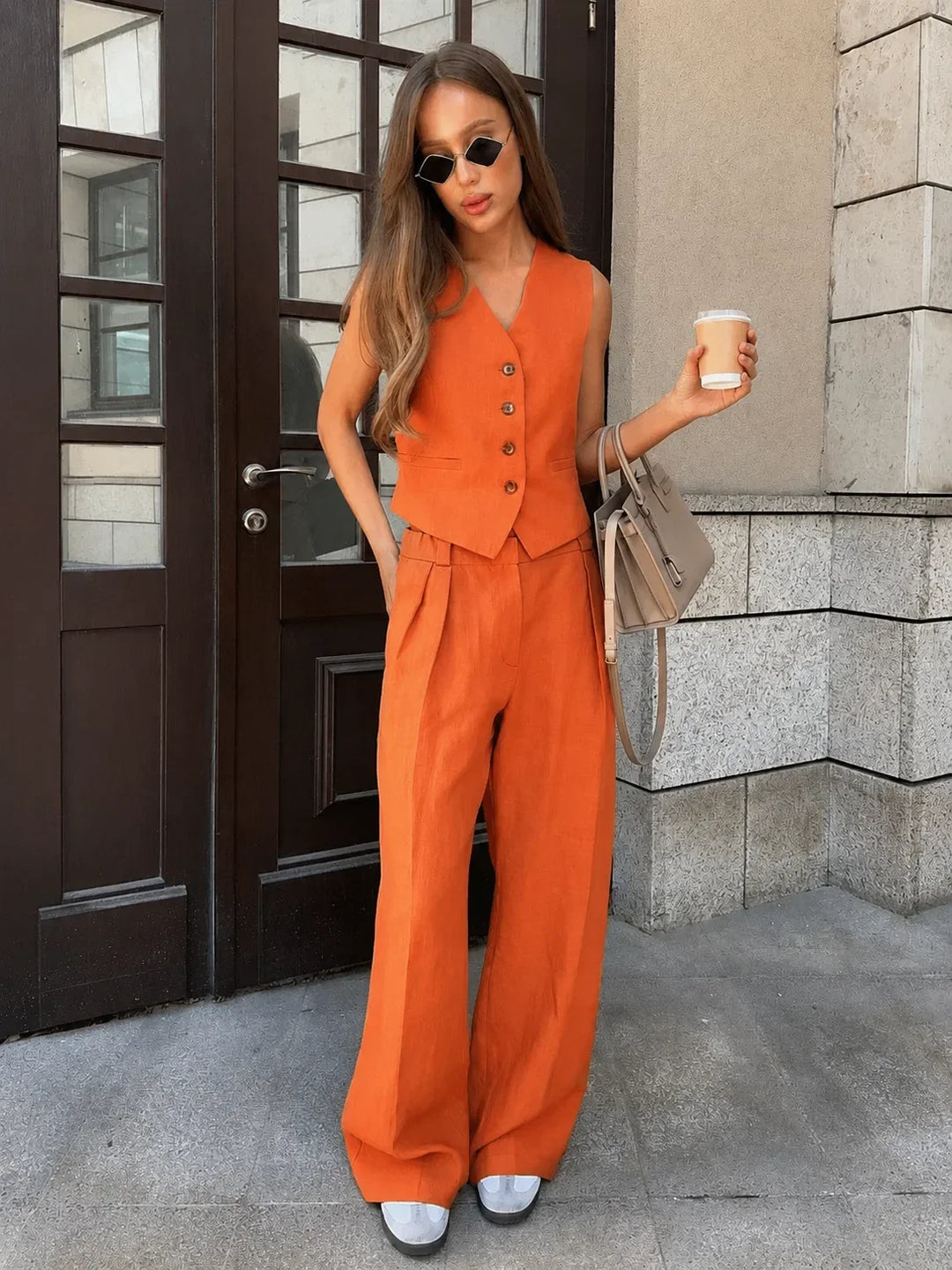 Lightweight linen V-neck vest and wide-leg trousers set, ideal for comfortable women's summer outfits.