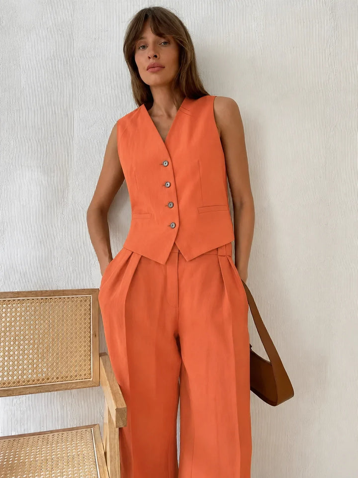 Model wearing a women's breathable linen V-neck vest and wide-leg trouser set, perfect for summer.