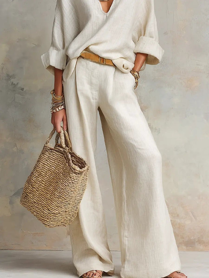 Effortless women's wide leg V-neck linen set, a comfortable two-piece outfit for summer relaxation.