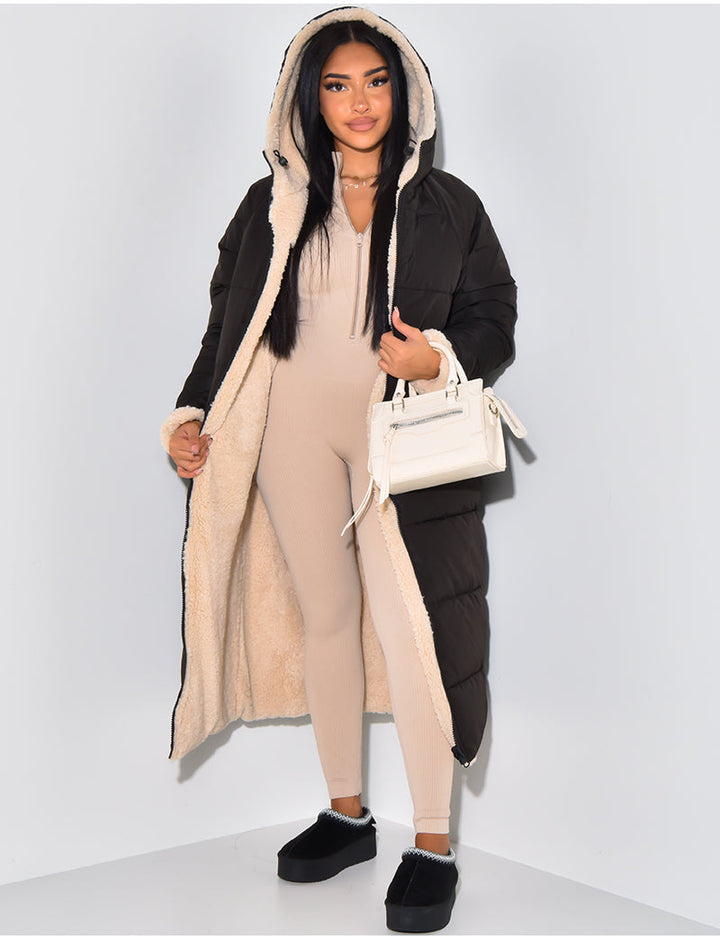 Women's long black puffer jacket with cozy hood. Warm quilted winter coat, perfect for cold weather everyday wear.